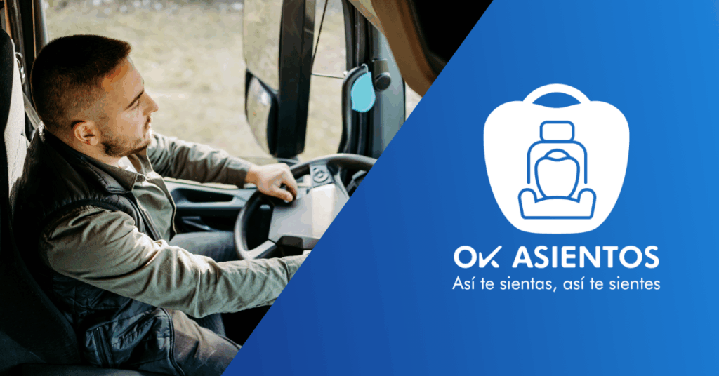 Un conductor profesional con barba corta y camisa de trabajo, sonríe mientras conduce un camión, con el logo de Ok Asientos y el texto "Así te sientas, así te sientes" al lado. La imagen muestra comodidad en la conducción de vehículos pesados.